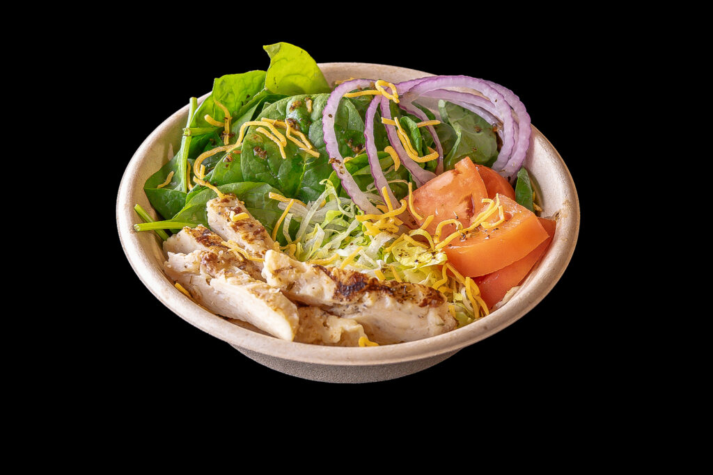 chicken ceasar salad in a bowl