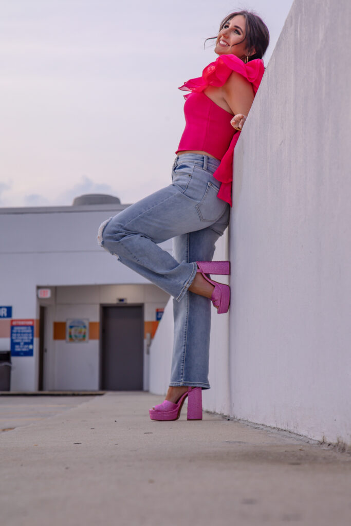graduation girl on the top of a parking garage
