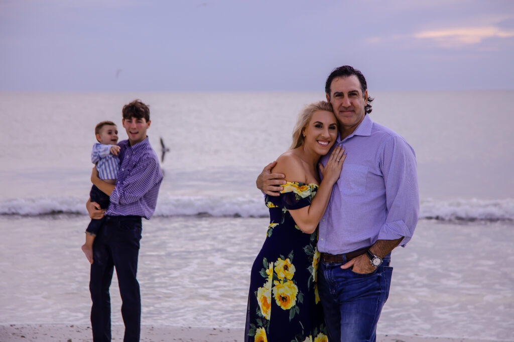 family of four on the beach