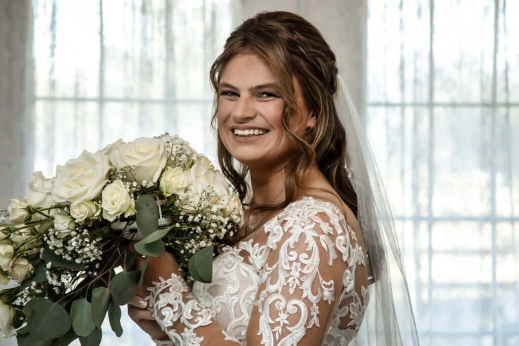 Bride looking at the camera with her flowers