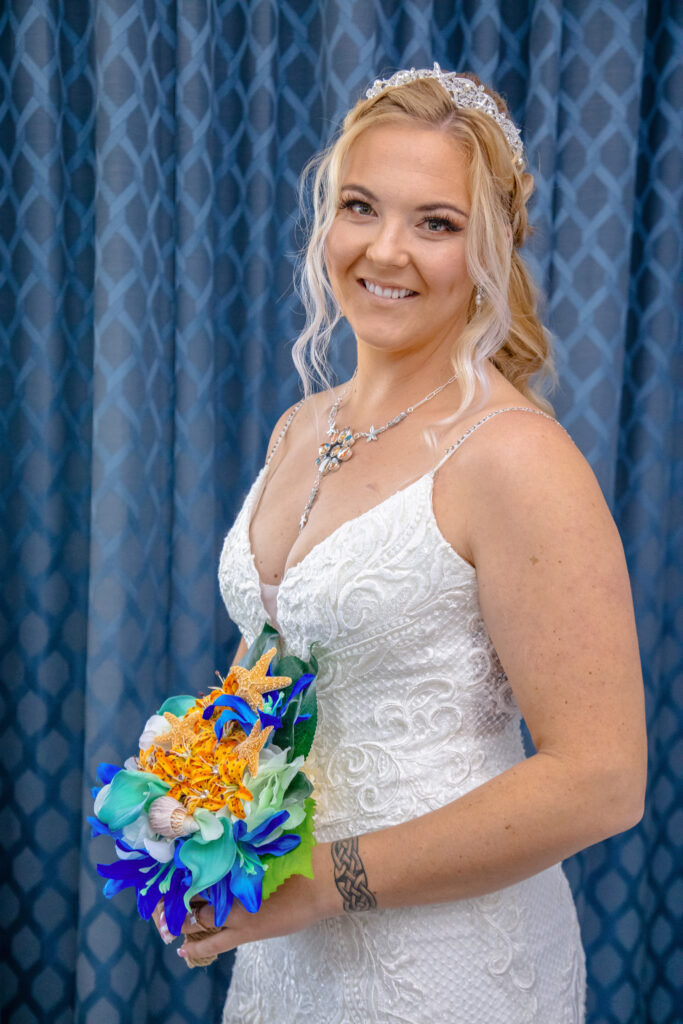 bride in her dress with her flowers