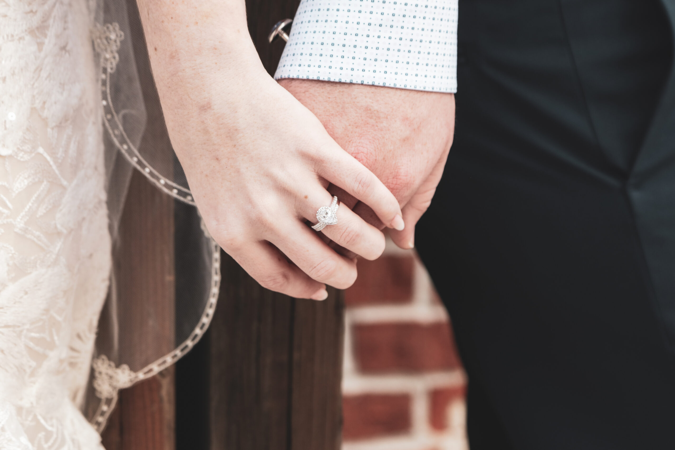 bride and groom holding hands