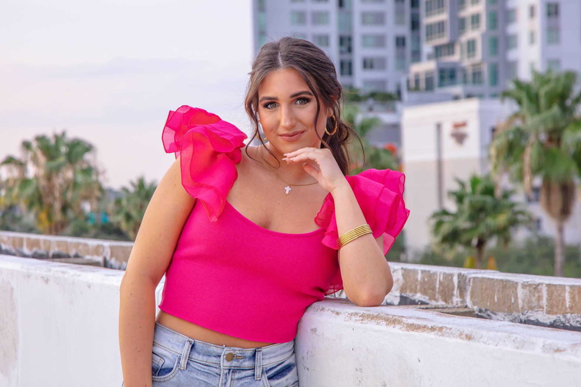graduation girl on the top of a parking garage