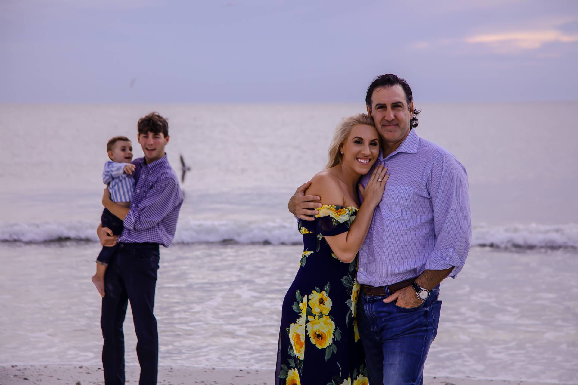 family of four on the beach