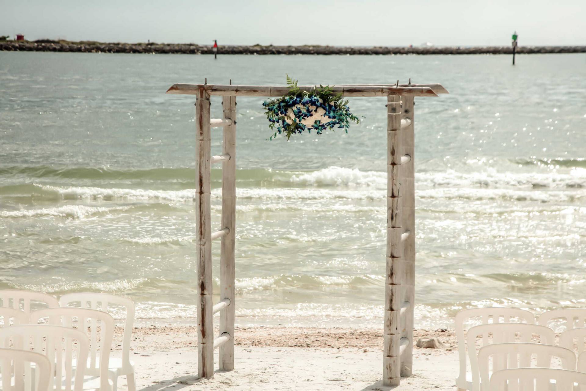 wedding arch on the beach by the water