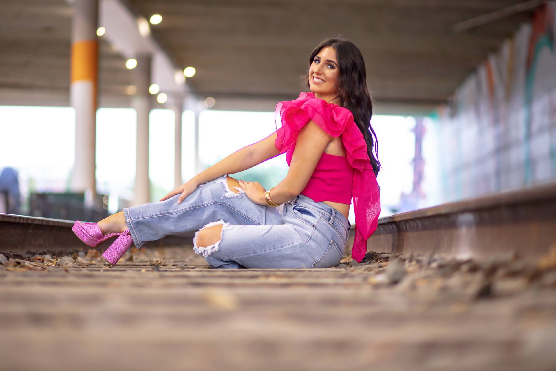 graduation girl on the railroad tracks
