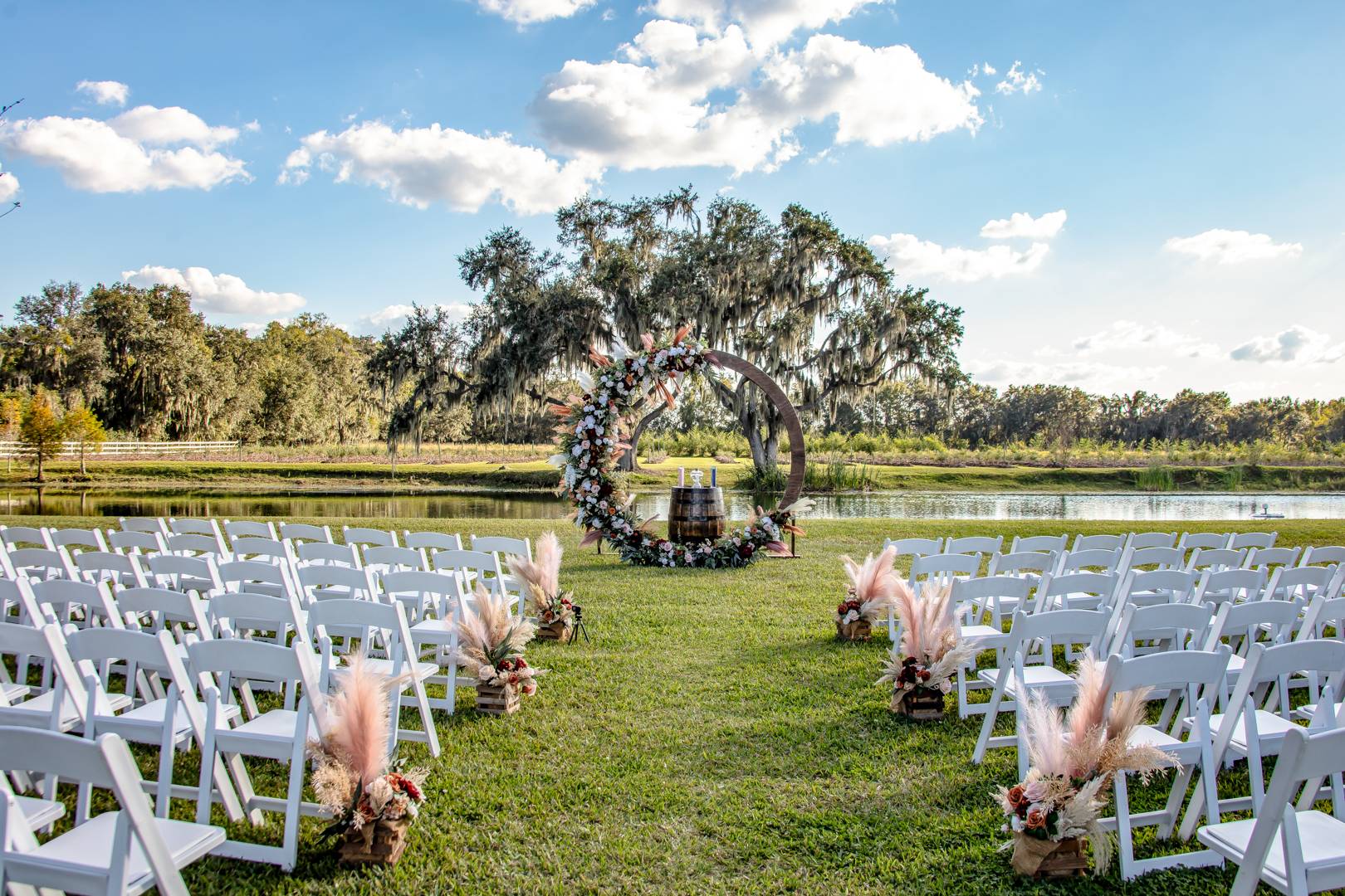 outdoor rustic wedding ceremony site on a lake